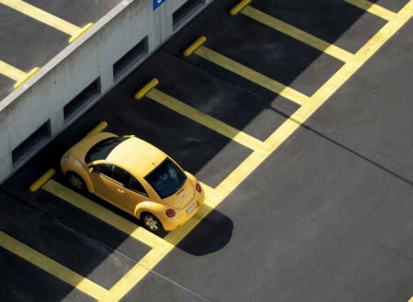 VW Beetle Parked In Parking Spot