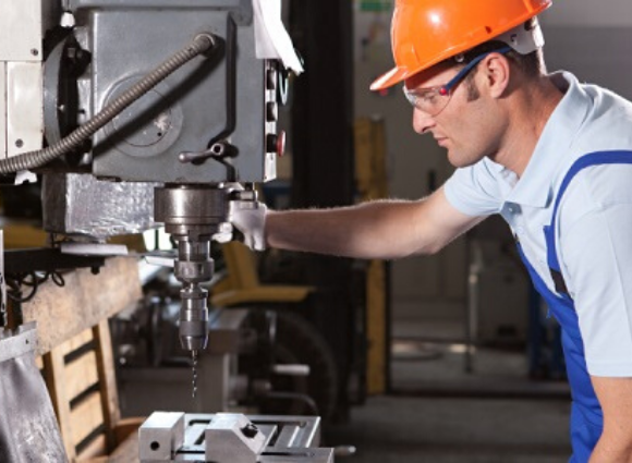 Man Looking At Machinery