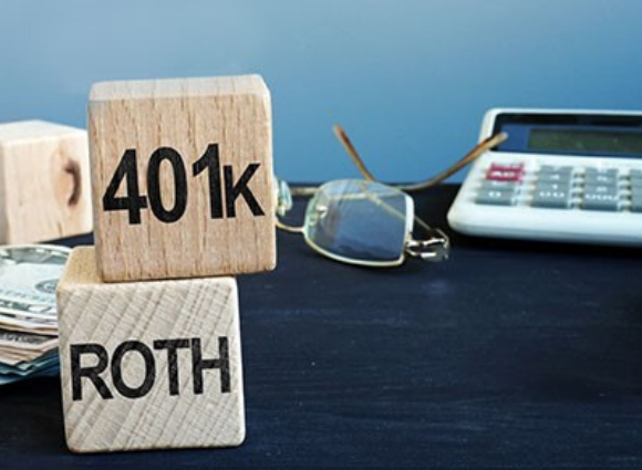 401k And Roth On Blocks With Calculator And Eyeglasses