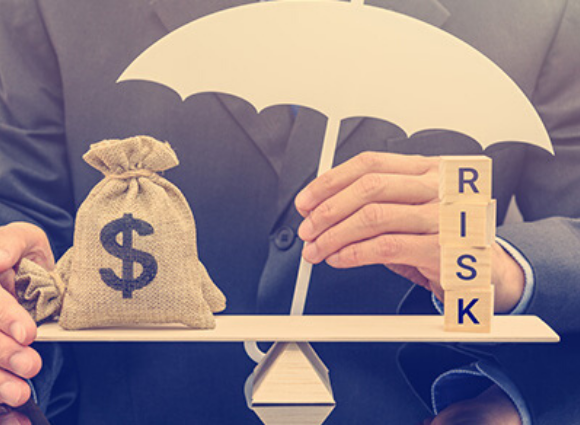 Person Holding An Umbrella With Risk Stacked
