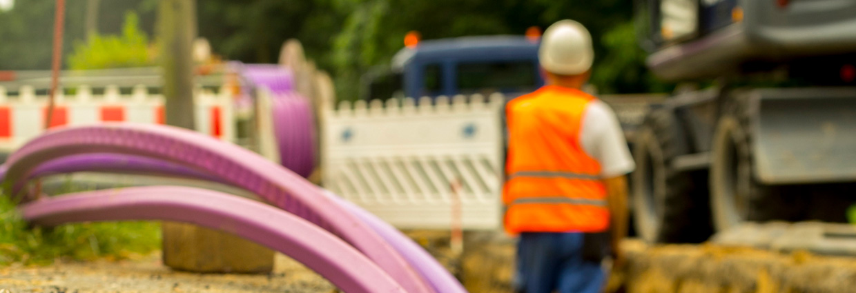 Underground telecommunications cable being installed on a suburban street