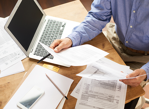 Man Reviewing Papers