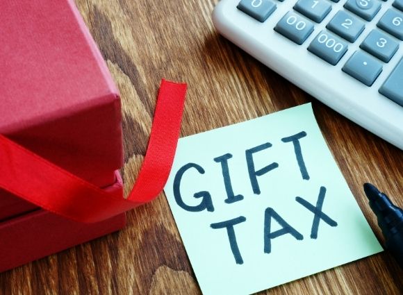 Gift Tax Post It With Present And Calculator