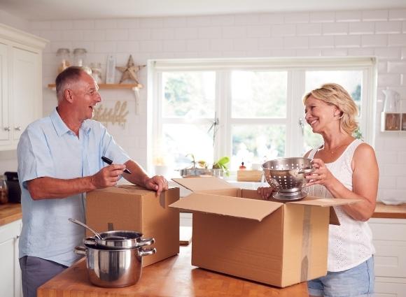 Older Couple Packing Boxes