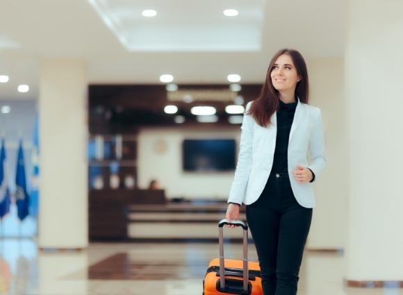 Woman Walking Through The Airport For Business Travel