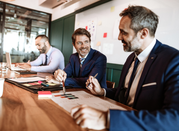 Photo Of Three Men In A Business Meeting