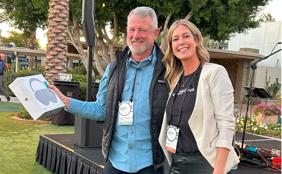 Martina Manley from ZayZoon took the stage and gave away a door prize - a pair of Apple AirPods Max headphones to the lucky winner, Michael Osborne.