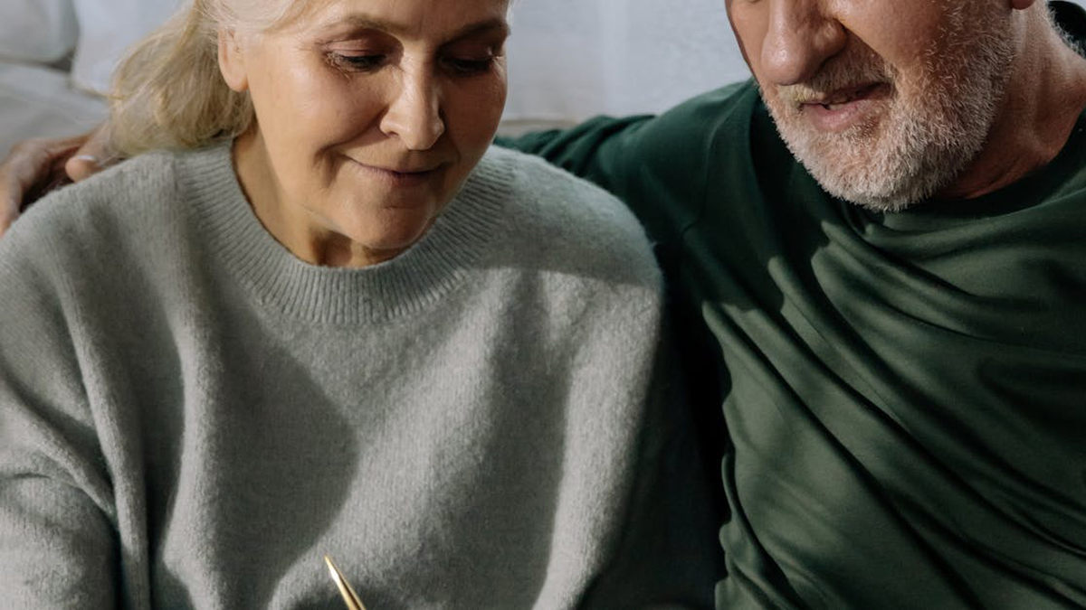 Photo Of A Man And Woman Planning For Retirement