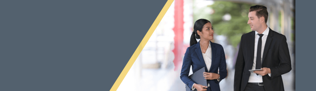 Female and Male young professionals walking in business suits